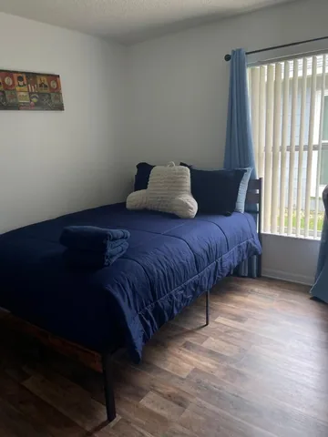 Bedroom with navy bedding