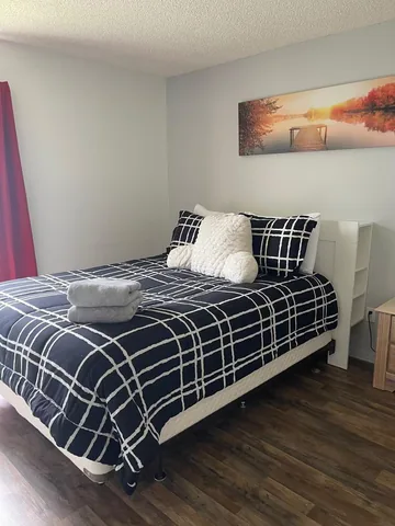 Bedroom with plaid bedding