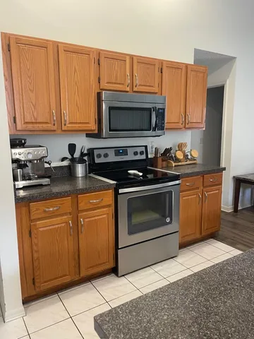 Kitchen with wood cabinets and stainless appliances
