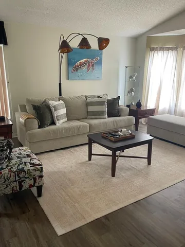 Living room with sofa, armchair and coffee table