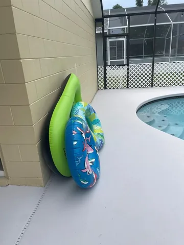Pool floats by the screened pool